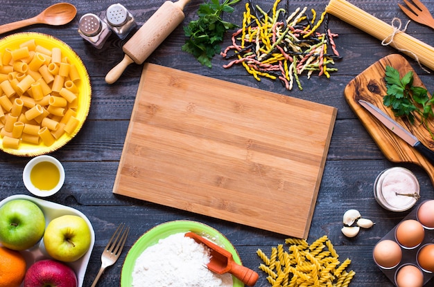 Several types of pasta with vegetables,  Free space for text. Top view