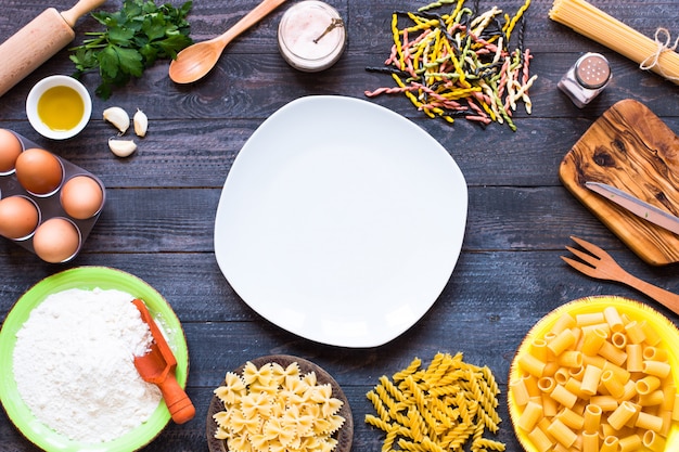 . Several types of pasta with vegetables,  . Top view