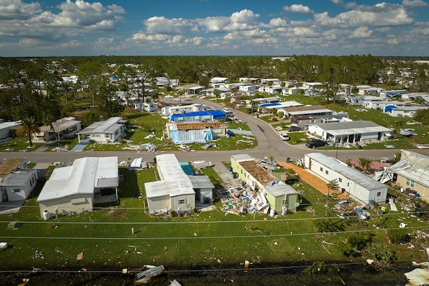 Severely damaged by hurricane Ian houses in Florida mobile home residential area Consequences of natural disaster