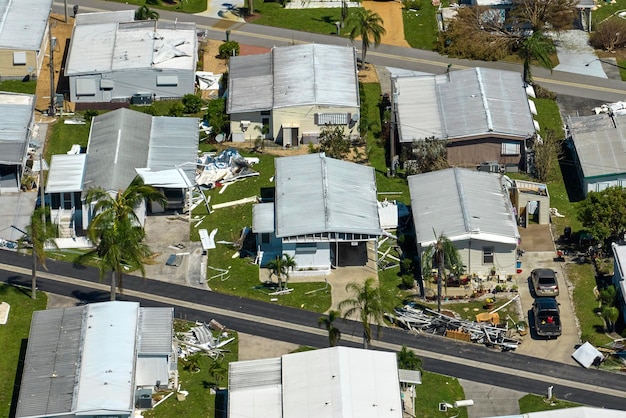 Severely damaged by hurricane Ian houses in Florida mobile home residential area Consequences of natural disaster