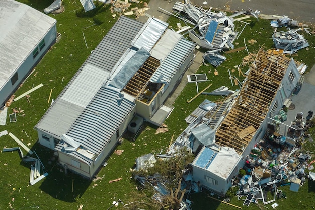 Severely damaged houses after hurricane Ian in Florida mobile home residential area Consequences of natural disaster