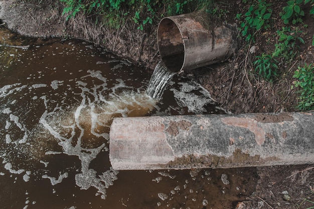 Sewage flows into the river Pollution of the river