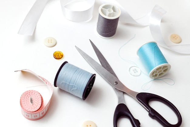 Sewing accessories for repairing clothes layout on a white background top view