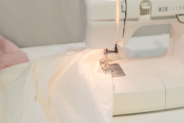 sewing machine, white fabric sewing, tailor