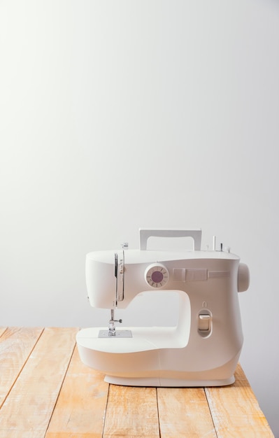 Sewing machine on wooden table