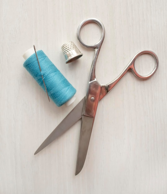 Sewing supplies, needlework supplies on a white table. The concept of sewing and hobby.