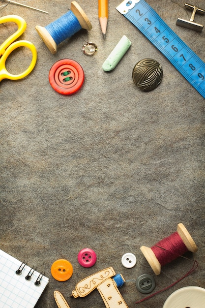 Sewing tools and accessories on table wall