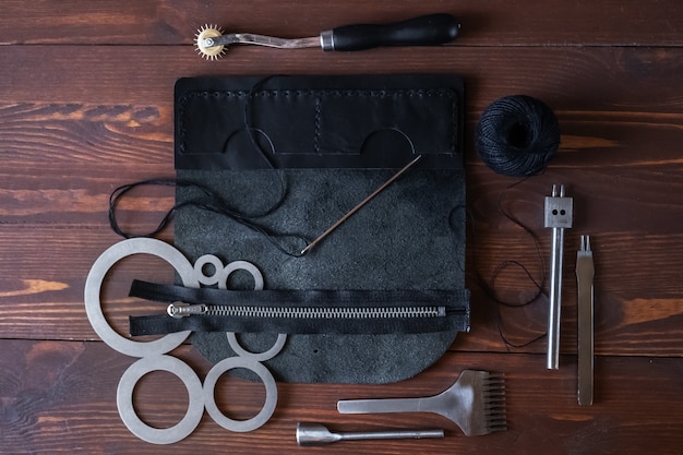 Sewing a wallet, purse, bags made of genuine leather. Tools for making products from genuine leather.