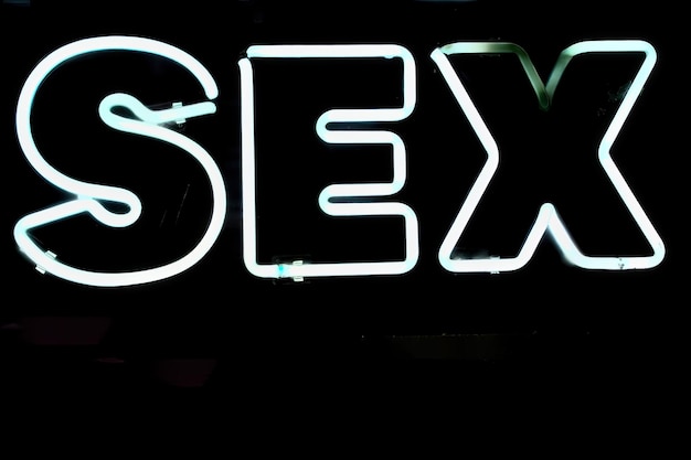 Sex neon sign on black