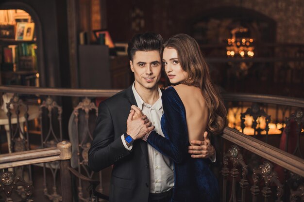 Sexual passionate couple in elegant evening dresses Luxurious interior Fashion shot