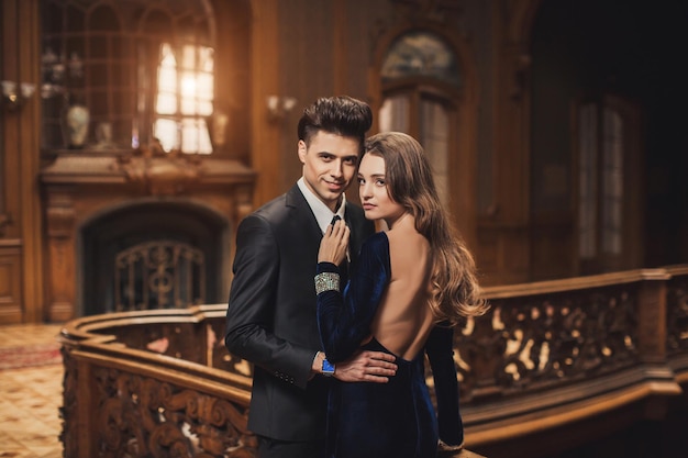 Sexual passionate couple in elegant evening dresses Luxurious interior Fashion shot