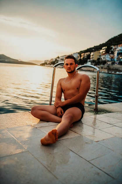 Sexy Fit man posing at the beach