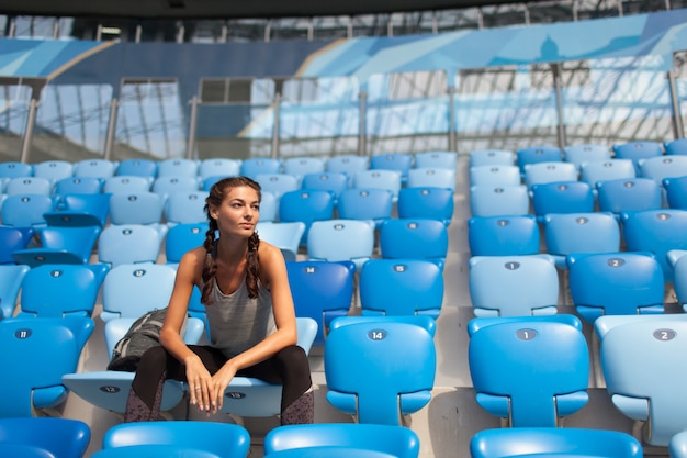 Sexy girl posing at stadium.