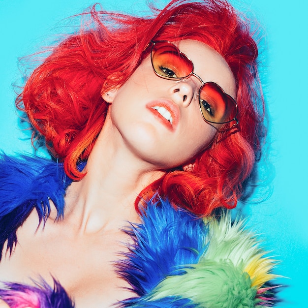 Sexy lady with red hair in the bright coat, Sunglasses hearts Club Style Party