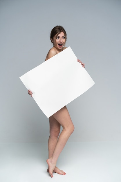 Sexy naked girl with a poster