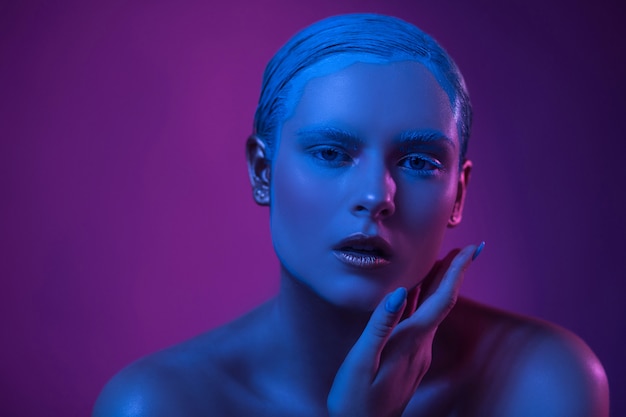 Sexy Opened Lips of High Fashioned Model in Neon Lights.