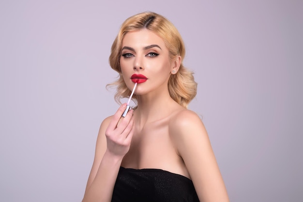 Sexy woman with lipstick photo of sensual girl with perfect makeup and plump lips on studio backgrou