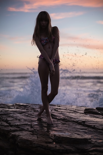 Shadow of attractive woman on sea background