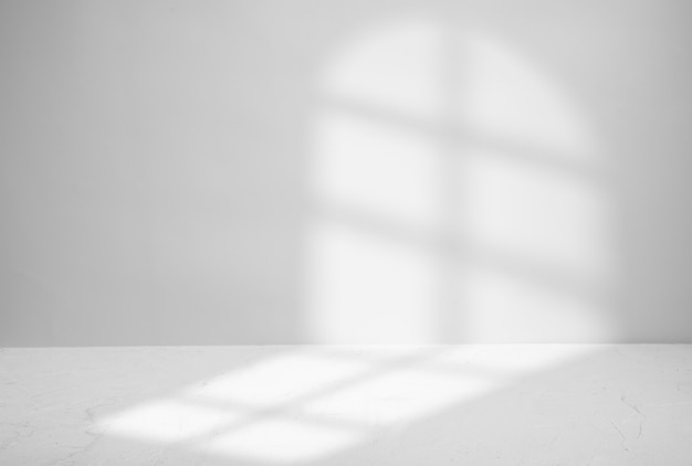 Shadow from the window on a gray. Space for product presentation