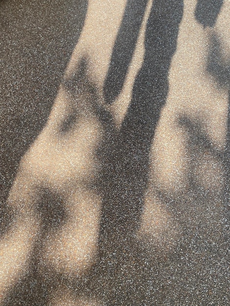 A shadow of a person on the ground