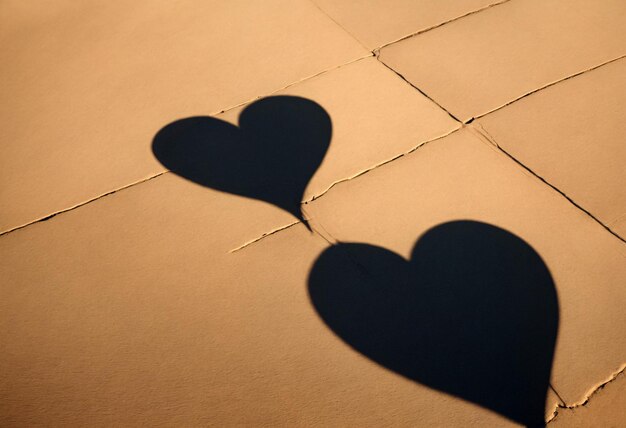 Photo shadows on the road in the shape of a heart