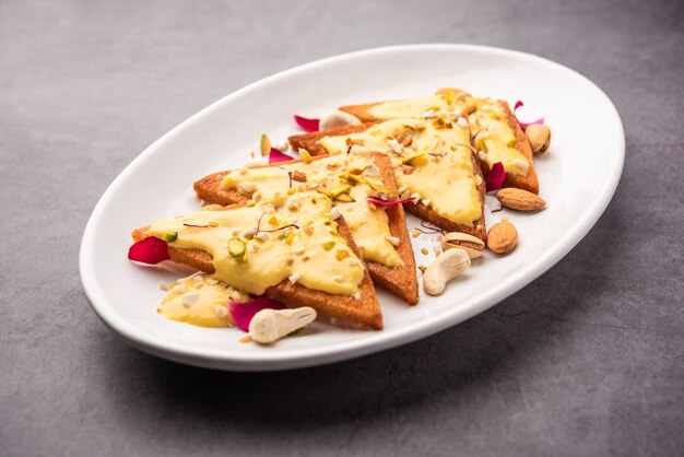 Shahi tukda or tukra also known as double ka meetha is a rich &amp; festive Indian dessert made with bread, ghee, sugar, milk and nuts