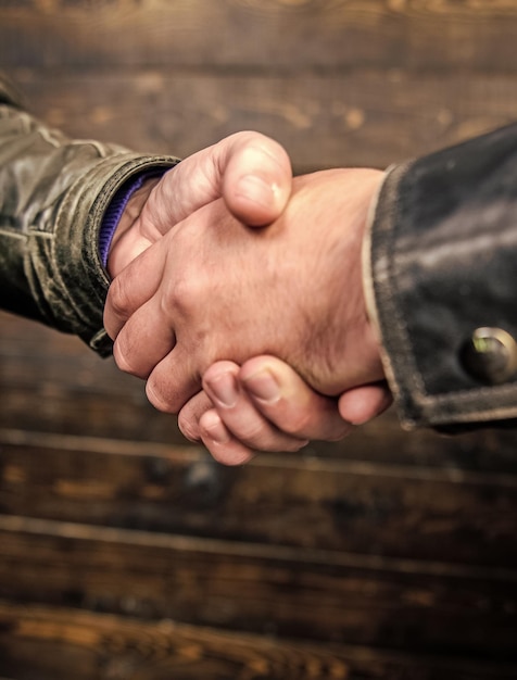 Shaking hands close up Handshake friendly gesture Handshake gesture concept Partnership and business deal Successful deal handshake Handshake approving sign Agreement compromise arrangement