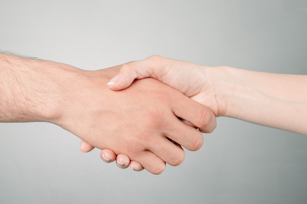 Shaking hands of two people