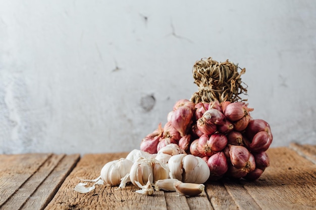 shallots with garlic on wooden table