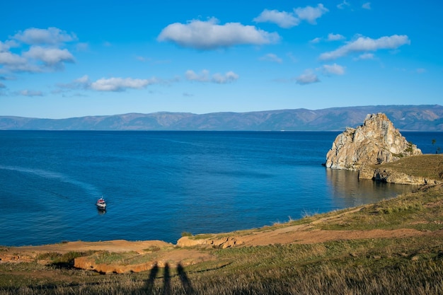 Shamanka Rock on lake Baikal near Khuzhir village at Olkhon island in September, Siberia, Russia. Lake Baikal is the deepest freshwater lake in the world.