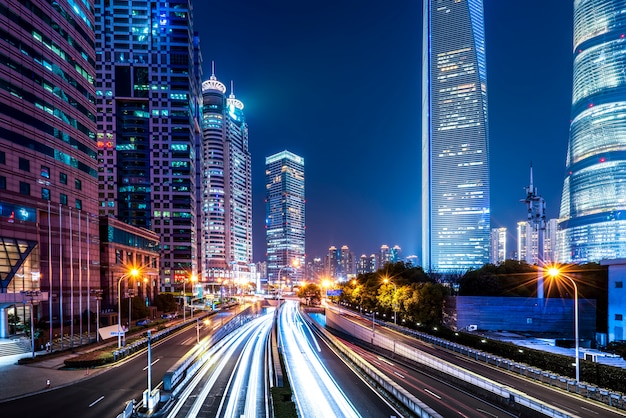 Shanghai city buildings at night and blurred car lights