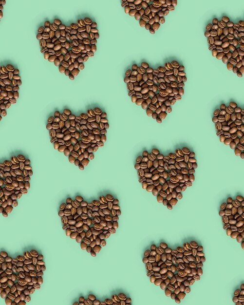 Shape heart from coffee beans roasted coffee berries trendy geometric pattern top view minimal