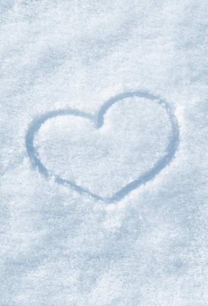 The shape of heart painted on the snow