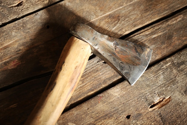 Sharp axe on wooden background