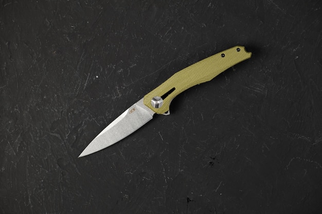 Sharp pocketknife on a black background