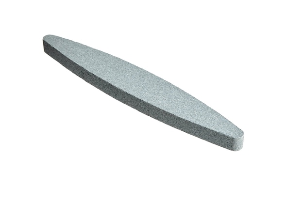 Sharpening stone. Grindstone or whetstone sharpener, isolated on white. Kitchen utensils