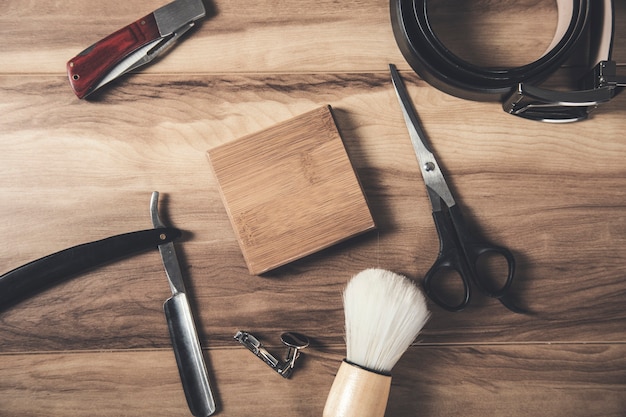 Shaving accessories and belt with knife