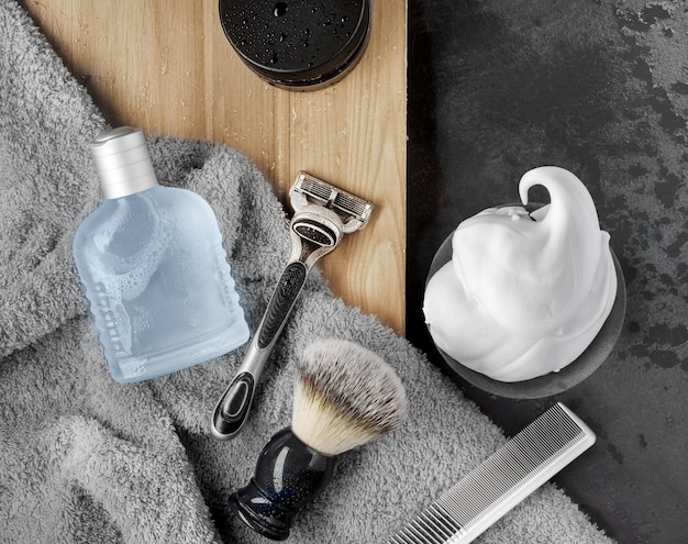 Shaving accessories set on a black background mockup flat lay