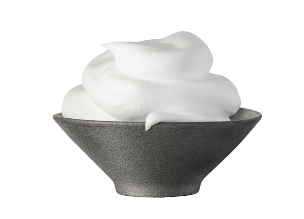 Shaving foam white cosmetic foam mousse cleanser in black ceramic bowl isolated on a white