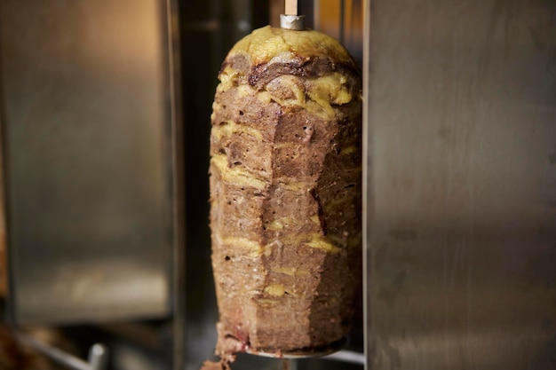 shawarma on a spit Doner kebab on a rotating vertical spit Traditional Turkish Meat Doner Kebab