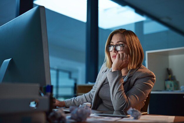 She just wants to get done Cropped shot of a businesswoman working late at night in her office