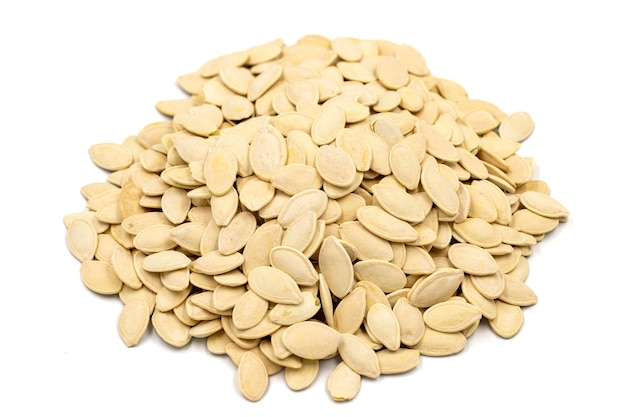 Shelled pumpkin seeds on a white background Closeup local name kabak cekirdegi