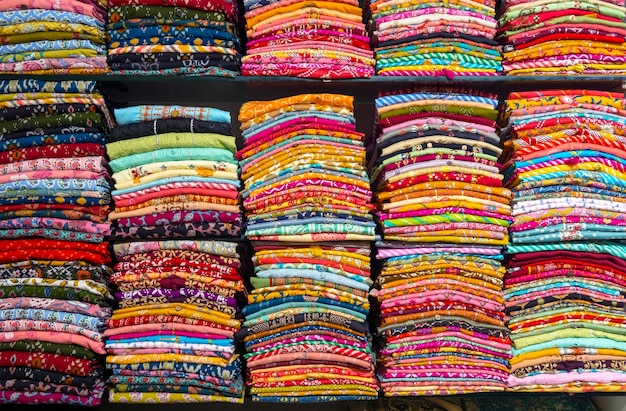 Shelves with sari or saree and other Indian clothes in India