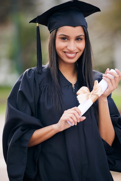 Shes destined for success Portrait of a young woman holding her diploma on graduation day