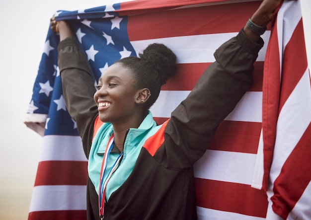 Shes a national hero. Cropped shot of an attractive young female athlete celebrating a victory for her country.