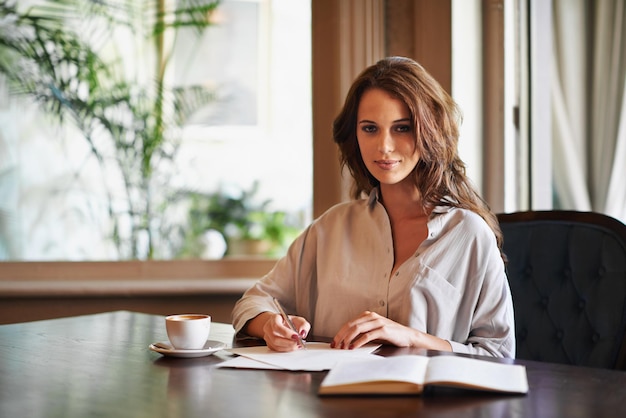 Shes preparing notes for her next novel Portrait of an attractive young woman writing in a relaxed environment at home