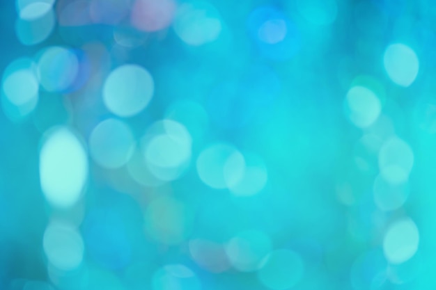 Shimmering glow sheen on blurred background Sky blue defocused bright lights background