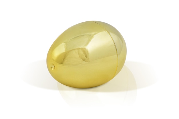 Shimmering golden egg isolated on white background with clipping path