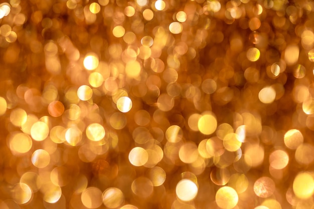 Shiny abstract festive background with golden bokeh