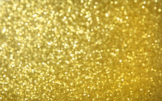 Shiny abstract gold glitter background, copy space